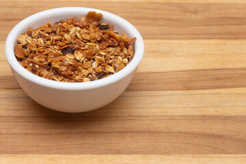 white bowl full of granola.