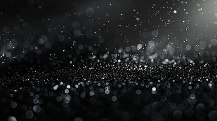 Fototapeta premium A close-up view of shimmering droplets on a dark surface, creating a dreamy atmosphere.