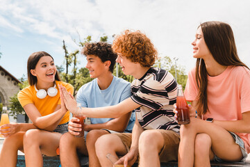 Smiling teenagers high school pupils friends classmates college students boys girls sitting on...