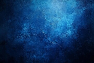Naklejka premium A grungy stone background texture with a radial gradient and copy space in blue