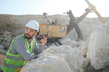 Male worker with bulldozer in sand quarry