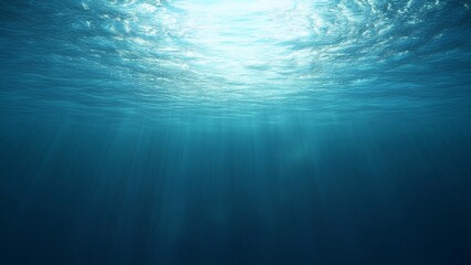 Obraz premium abstract background features a dark blue ocean surface as seen from an underwater perspective