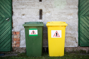 Waste recycling concept. Green and yellow waste sorting containers