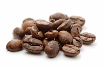 Scattering of roasted coffee beans lay on a white background