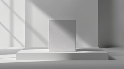 Fototapeta premium A white pedestal supports a plain cube, illuminated by soft natural light streaming through a nearby window, creating a peaceful and modern atmosphere