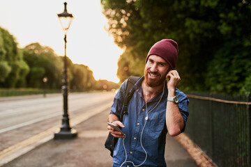 Travel, walking and portrait of man in city for music, streaming subscription and online radio....