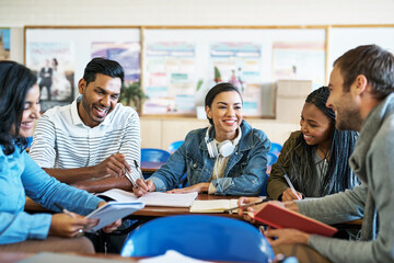 Happy, students and classroom for group assignment with education on teamwork and collaboration at college. Diversity, classmates and people with studying for exams, assessment and test on campus