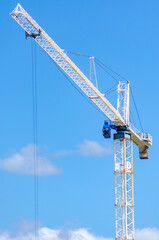 Close-Up of Construction Crane Against Clear Blue Sky on a Sunny Day