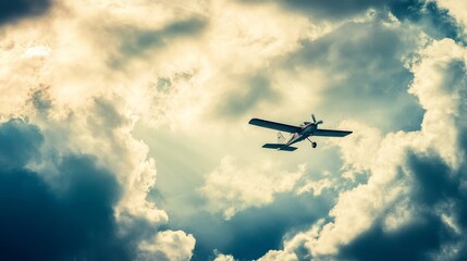 Photo of an airplane flying in a cloudy sky