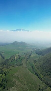 Aerial vertical video of the Iztaccihuatl and Popocatepetl volcanoes. Travel and nature concept.