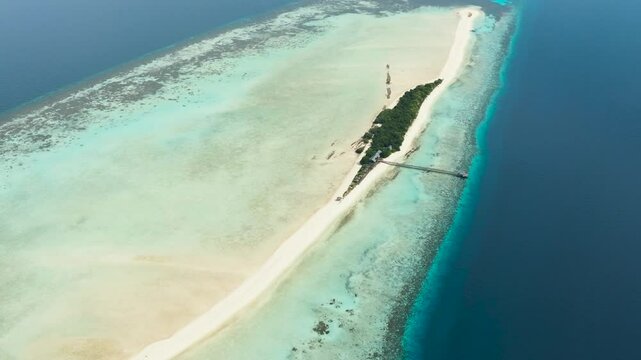 Aerial drone of tropical island on the atoll and coral reef. Timba Timba islet. Tun Sakaran Marine Park. Borneo, Sabah, Malaysia.