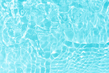 Blue water with ripples on the surface. Defocus blurred transparent blue colored clear calm water...