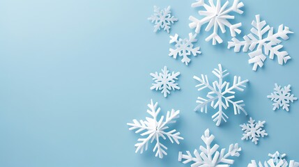 Winter Wonderland: White Snowflakes on a Light Blue Background