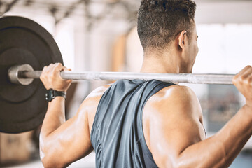 Fototapeta premium Man, back and bodybuilder with barbell in gym for weightlifting, training and strength workout. Athlete, power and person with muscle exercise at health club for fitness, challenge and endurance