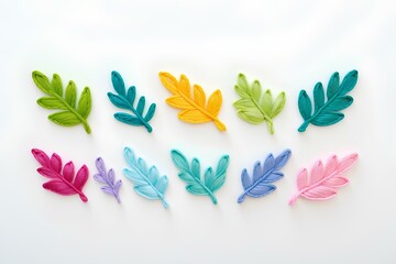 Obraz premium colorful leaf cutouts arranged in a creative pattern, representing artistic design, nature-inspired creativity, and the beauty of fall foliage in vibrant colors