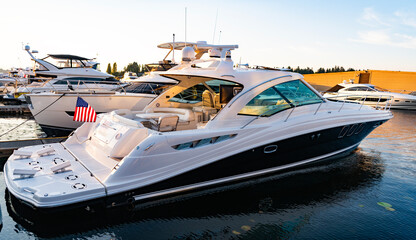 Marina bay. Luxury motor yacht in sea marina bay. Yacht in boat harbor. Private luxury boat for best summer vacation. Summer boat vacation. Boat yachting. Yacht vacation in summer. Boating community