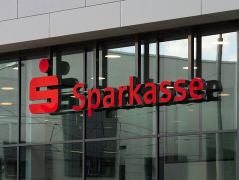 DRESDEN, GERMANY - 21. August 2024: Sparkasse logo sign of the German savings bank on a building. Red emblem and lettering of the financial service company.