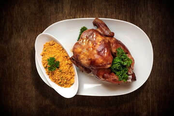 Roast Chicken with Farofa on a plate seen from above