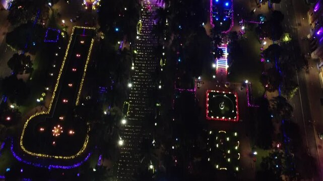 Drone video of Pra&ccedil;a da Liberdade in Belo Horizonte, Brazil, at night, beautifully illuminated with festive Christmas lights, showcasing the holiday spirit in the heart of the city.