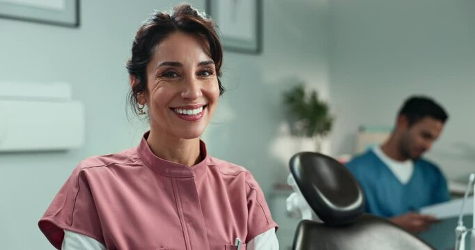 Happy woman, dentist and dental hygienist with assistant at clinic for teeth care, cleaning or surgery. Portrait, female person or orthodontist with smile for tooth whitening or health insurance