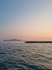 This is the sunset over the sea where the fish farm is located.