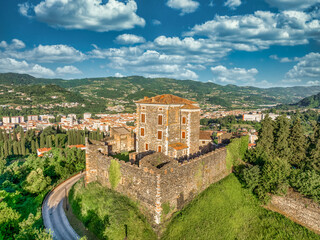 Aerial view of Arzignano castle with medieval walled town, tall clock tower, fortified gates,...