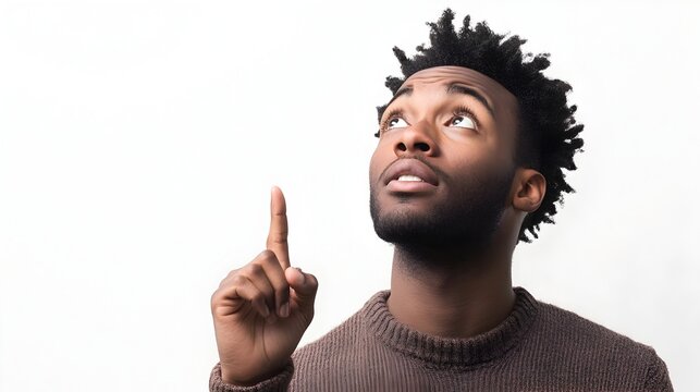 Portrait of a thoughtful person pointing upwards on a minimalist white background