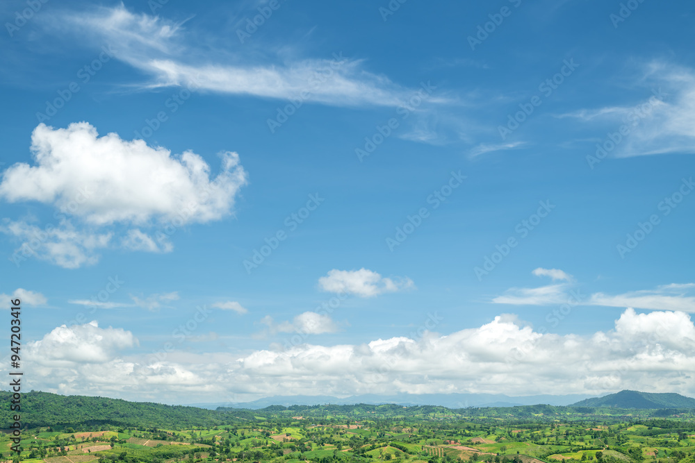 Wall mural beautiful white clouds and blue sky with beautiful natural landscape of mountains.