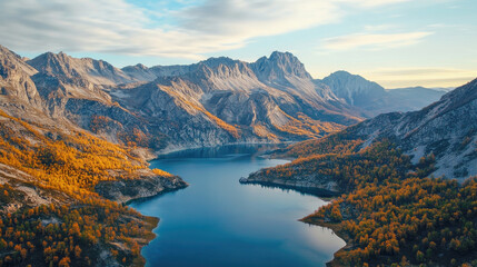 Naklejka premium Aerial view of the lake surrounded with mountains in autumn day