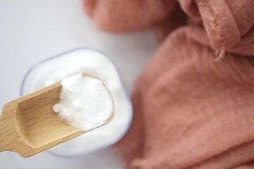 Baking soda and a cloth on a table 