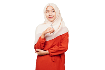 Smiling confident asian hijab girl holding pen isolated transparent
