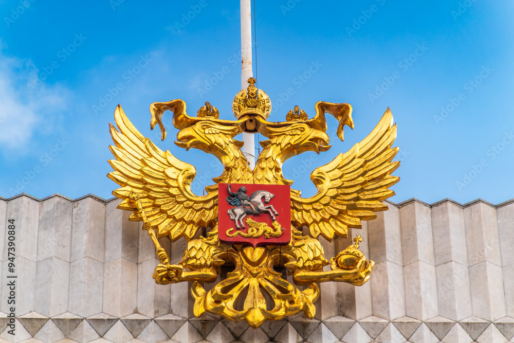 Wall mural Double golden eagle. Coat of arms of Russia on the roof top of the Big Kremlin concert hall