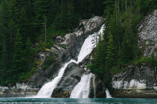 Waterfall in Tracy Arm fjord south of Juneau Alaska in Tongass National Forest during summer