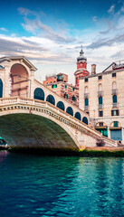 Splendid scene of famous Canal Grande. Colorful spring view of Rialto Bridge. Picturesque morning cityscape of  Venice, Italy, Europe. Traveling concept background.