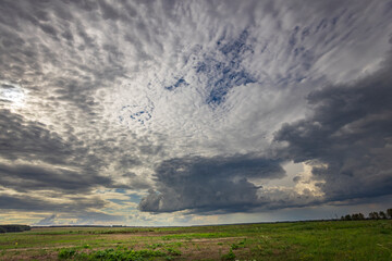 A cloudy sky with a large cloud in the middle