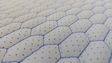 Fototapeta premium Leather blue stitched with perforated pattern honeycomb black texture or background 