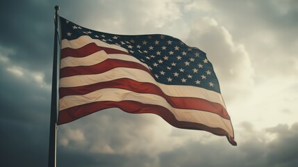 Obraz premium An american flag with black and white stars waving in the wind, symbolizing unity and freedom.