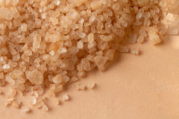 Close up of bath salt texture on beige background with copy space