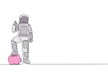 Single continuous line drawing astronaut stands with thumbs up pose and steps on the piggy bank with one of foot. Happy to release assets to conduct space research. One line design vector illustration