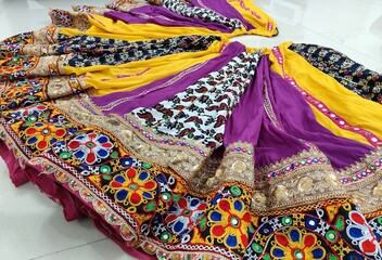 ghaghra - chaniya choli for navratri. multicolor full flare skirt for garba and dandiya. patola and cotton fabric with kanch kachhi and golden laces work in the bottom. 12 meter gher of lovely outfit