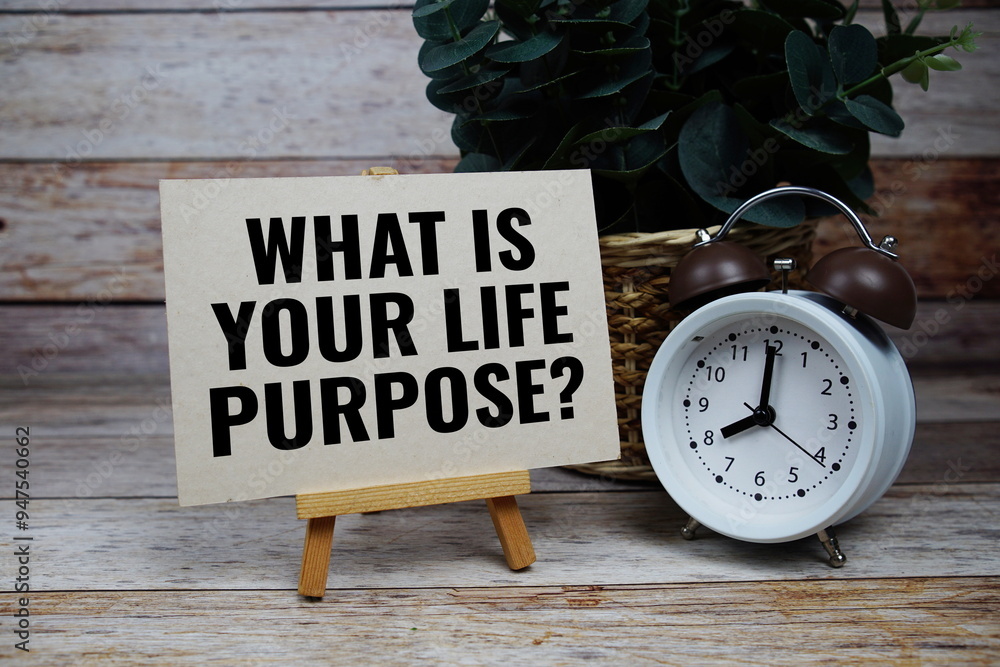 Poster what is your life purpose? text with alarm clock on wooden background