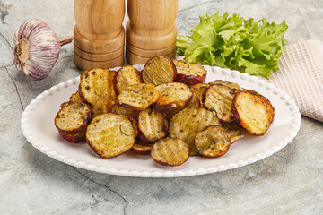 Baked red batat slices with herbs