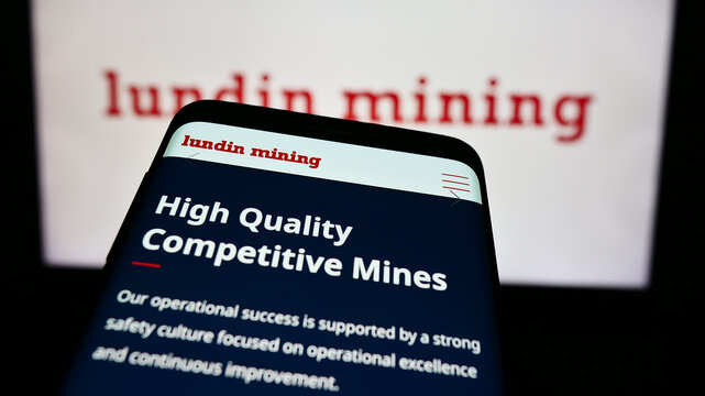 Stuttgart, Germany - 08-20-2024: Mobile phone with website of Canadian company Lundin Mining Corporation in front of business logo. Focus on top-left of phone display.