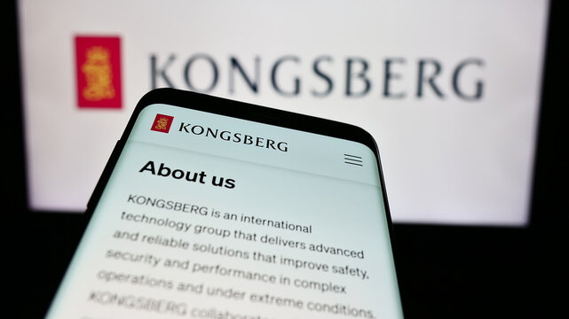 Stuttgart, Germany - 08-20-2024: Mobile phone with website of Norwegian company Kongsberg Gruppen ASA in front of business logo. Focus on top-left of phone display.