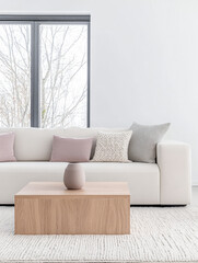 Modern interior design composition with a sofa, coffee table and minimalist decor next to a large window. Luxury interiors in neutral tones.