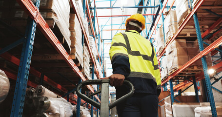 Warehouse, man and worker pull pallet truck for supply chain, restock inventory or moving storage...