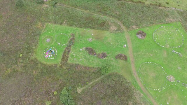 Aerial view of a group of women worshipping at the Beaghmore Stone circles at Blackrock Road by Cookstown in County Tyrone, Northern Ireland
