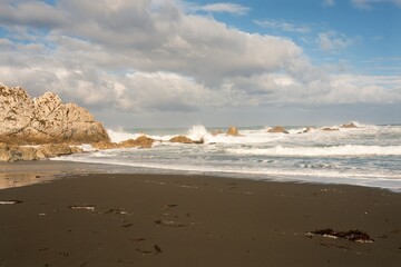 Heavy Waves Crashing on the white rock at new zealands coast