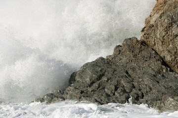 Heavy Waves Crashing on the white rock at new zealands coast
