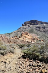 Scenic view of volcanic rock formations in desert during sunny day, Teide National Park, Tenerife